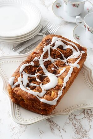 top view apple fritter loaf bread cake with icingの写真素材