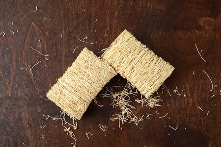 shredded wheat cereal on wood tableの写真素材