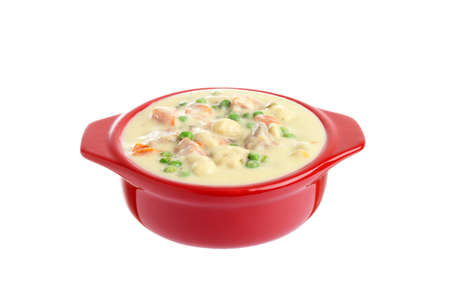 isolated bowl of chicken vegetable cream soupの写真素材