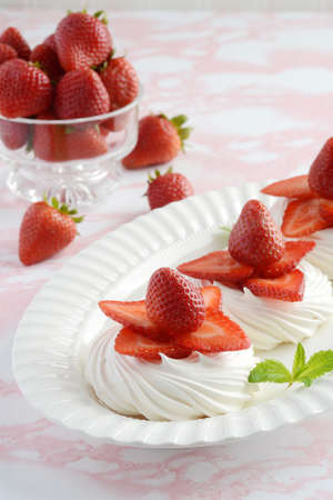 dessert platter of strawberry meringue nestsの写真素材
