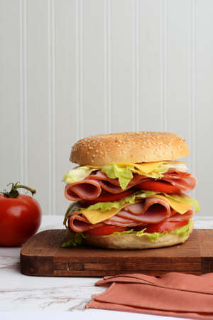 ham and cheese sandwich on wood cutting boardの写真素材