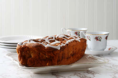 apple fritter loaf cake with icing sugarの写真素材