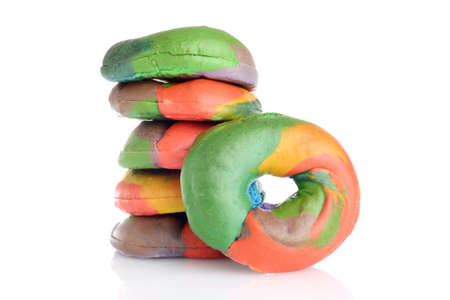 stack of fresh rainbow bagelsの写真素材
