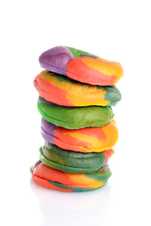 closeup stack of rainbow bagelsの写真素材