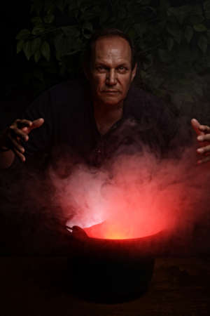 portrait evil man with smoke and cauldron