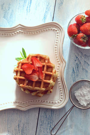 closeup top view Belgian waffles with strawberriesの写真素材