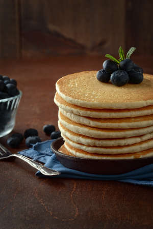 closeup breakfast blueberry pancakes with a forkの写真素材