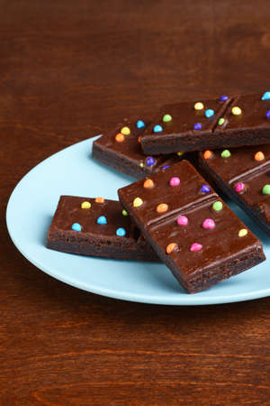 chocolate fudge brownies on a blue plateの写真素材