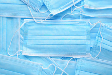 closeup blue medical masks with ear loops backgroundの写真素材