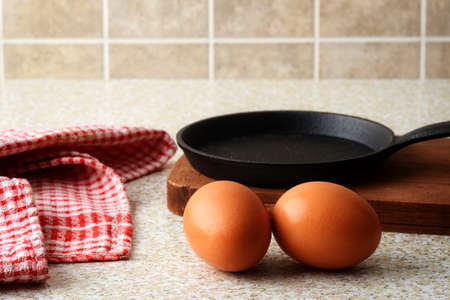 farm fresh eggs with frying panの写真素材