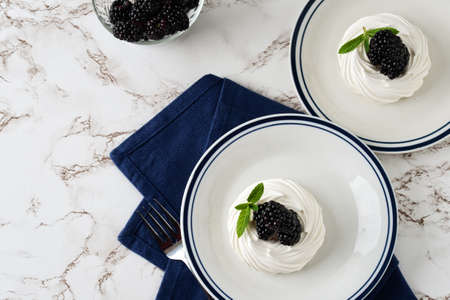 high angle view blackberries with meringue and mintの写真素材