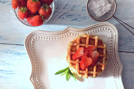 high angle homemade belgian waffles with strawberriesの写真素材
