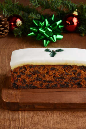 closeup fruit cake on wood cutting boardの写真素材