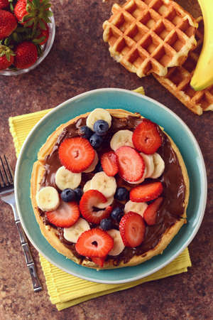 Top view fruit waffle with chocolate spreadの写真素材