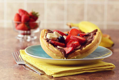 closeup of fruit waffle sandwich with chocolate spreadの写真素材
