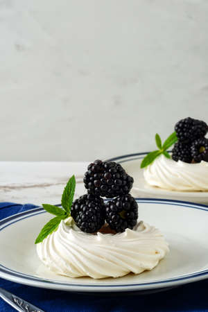 closeup of blackberry meringue nest with mintの写真素材