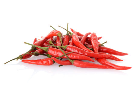 Closeup pile of Hanoi Red Peppers Vietnamese Chili on whiteの写真素材