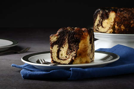 closeup chocolate marble pound cake with forkの写真素材
