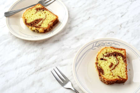 closeup cinnamon swirl cake on a plateの写真素材