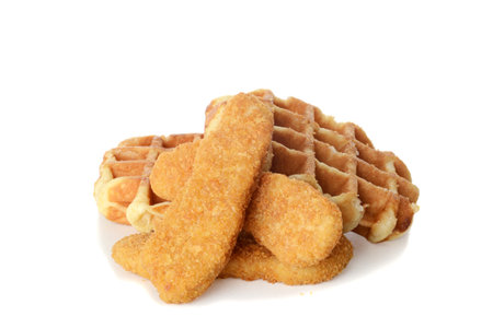 chicken tenders and belgian waffles on whiteの写真素材