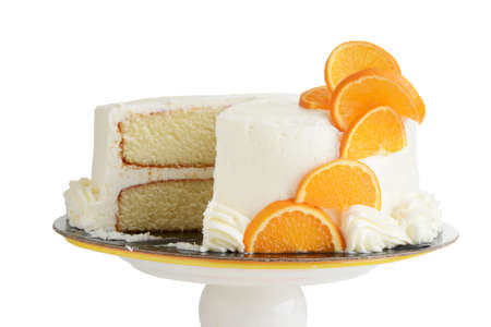 isolated sliced vanilla cake with orange slicesの写真素材