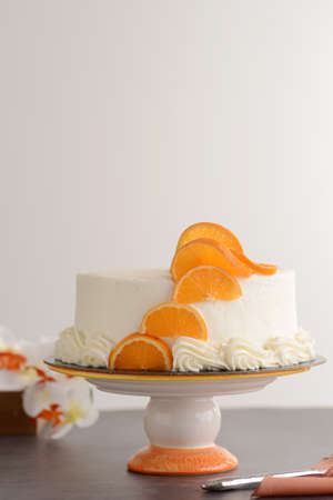 vanilla cake with napkin and a knifeの写真素材