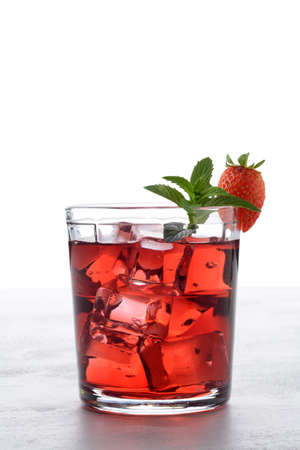 backlit strawberry mint rum cocktail mojito on whiteの写真素材