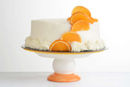 vanilla orange cake on a cakestandの写真素材