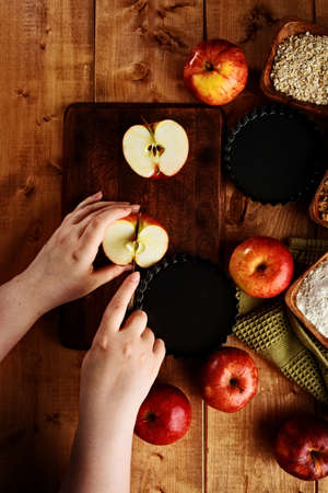 cutting apples ready for bakingの写真素材
