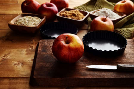 closeup gala apple on cutting board with knifeの写真素材