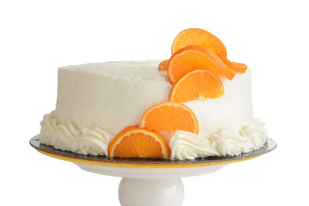 isolated closeup vanilla cake with orange slicesの写真素材