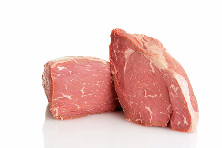 closeup of two sirloin tip roasts on a white backgroundの写真素材