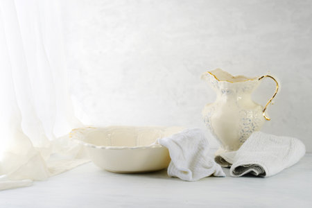 old wash basin and pitcher close to window