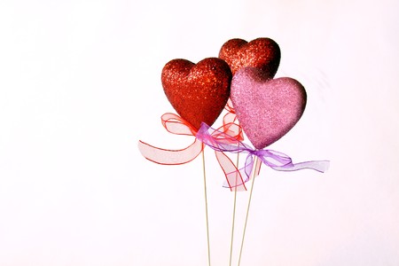 Pink and Red Hearts on White Background with ribbons
