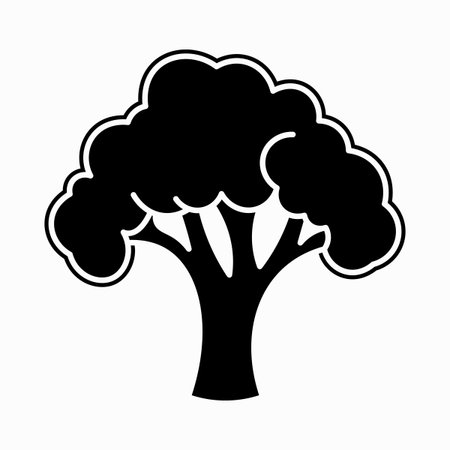Simple black silhouette of a tree with a leafy canopy and thick trunkのイラスト素材