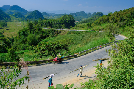 Ha Giang / Vietnam - 01/11/2017: Motorbiking backpackers on winding roads through valleys and karst mountain scenery in the North Vietnamese region of Ha Giang / Dong Van.のeditorial素材