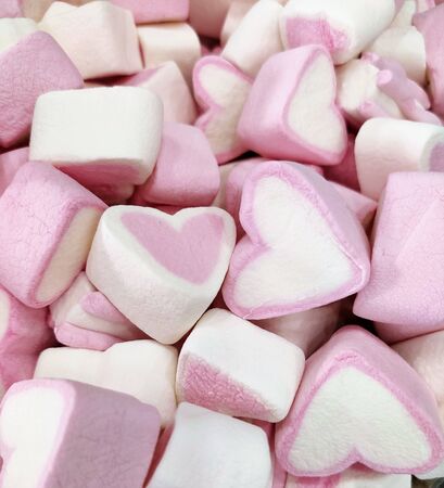 background of pink and white hearts marshmallow, sweet soft delicate mottled texture full space, top view, flat layout, love and Valentines dayの写真素材