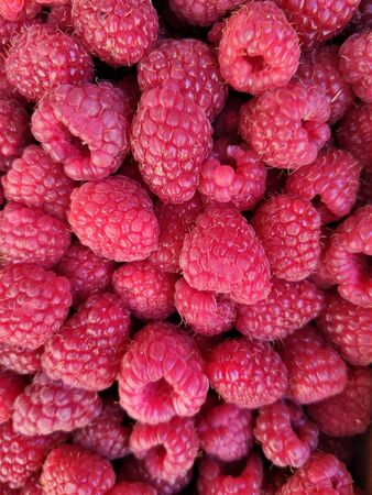 background ripe raspberries, abstract flat layout, food photo fruit composition top view, crimson...