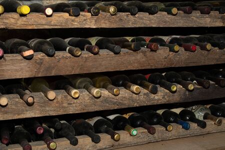 Old wine bottles in the wine cellar. The cellar is located in Montenegro in the region of Crmnica.
