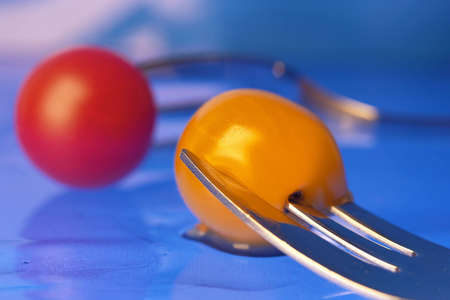 Cherry tomatoes. Close up of red and yellow cherry tomatoesの写真素材