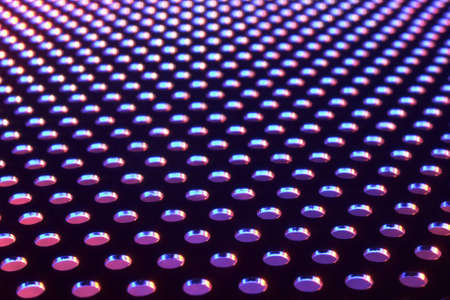 Close-up of metal plate under low light.の写真素材