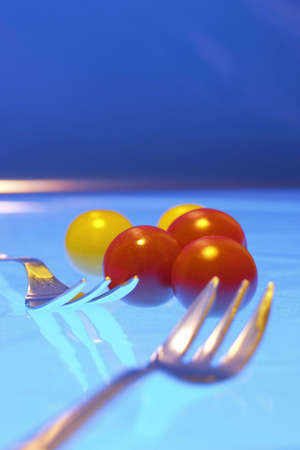 Cherry tomatoes. Close up of red and yellow cherry tomatoesの写真素材