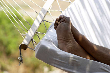 Man slipping on hammockの写真素材