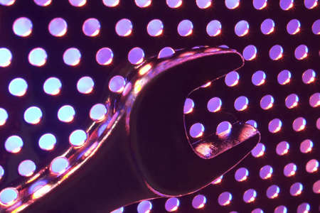 industrial tool on metal plate under low light.の写真素材