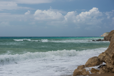 Rough, textured rock on seashore of aegean sea in a sunny day.の写真素材