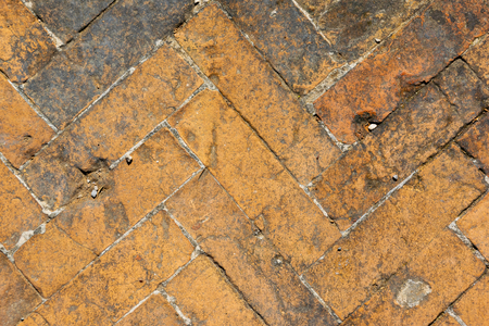 old worn, cracked red brick floorの写真素材