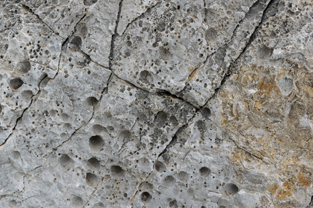 an old rough, weathered, textured rock surface