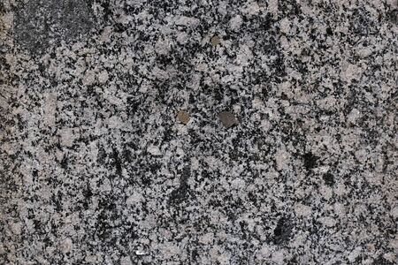 Old granite stone wall. ancient wall. masonry texture, stonework pattern background.の写真素材