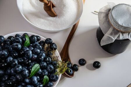Huckleberry Jam close-up. Blueberry and sugar in a bowl in the kitchen.の写真素材