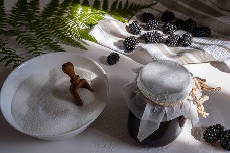 Blackberry berries on the table in the kitchen close-up.の写真素材